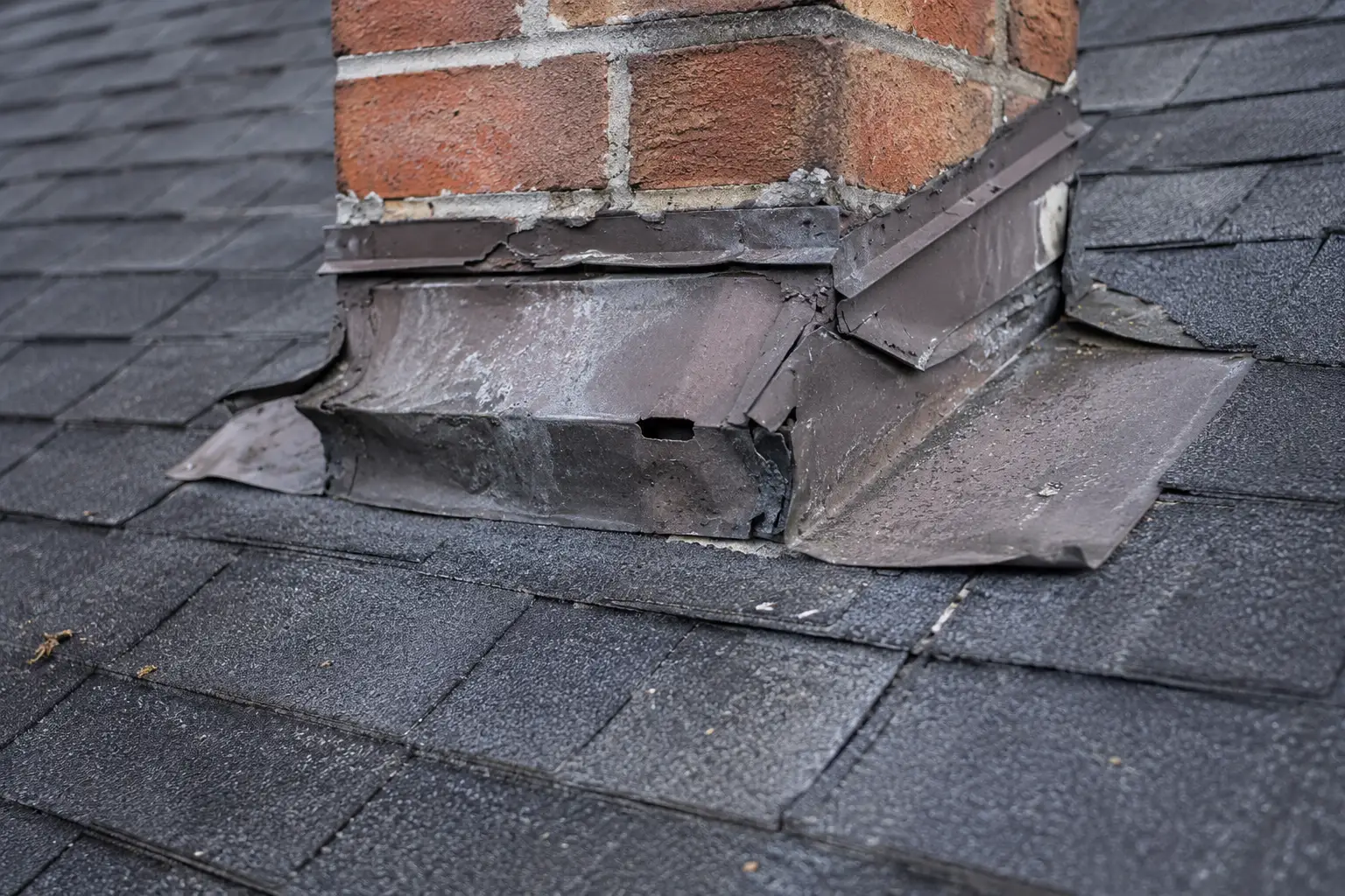 Missing roof shingles documented after storm damage